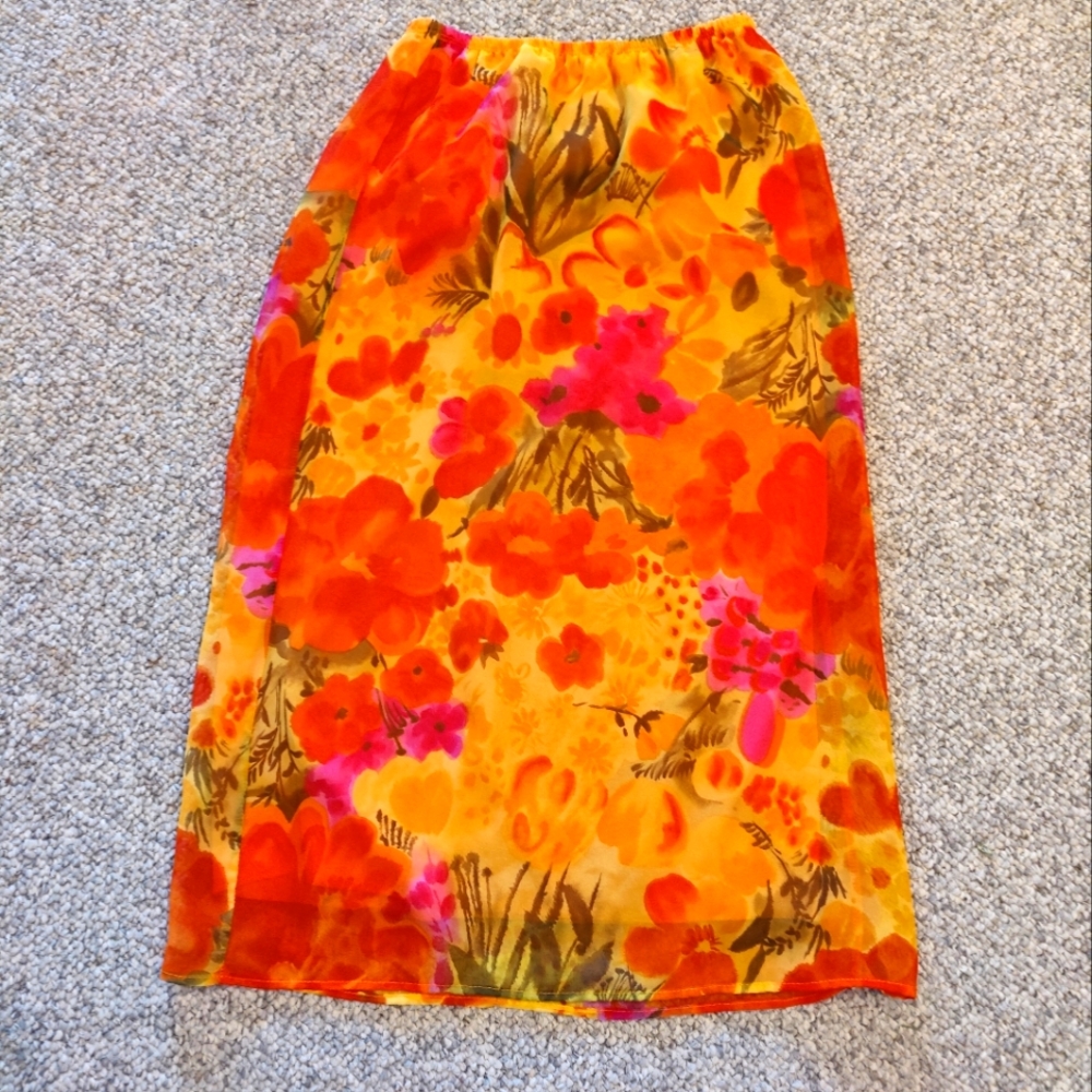 Adorable maxi floral skirt. Lovely bright colors of orange, yellow and greens.